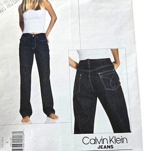 May include: A sewing pattern for jeans by Calvin Klein, Vogue American Designer. The pattern is for size 6 and has the number 2264 printed on it.