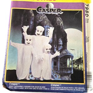 May include: A McCall's Costumes pattern for a Casper the Friendly Ghost costume. The pattern is for adults in sizes small through extra large and for children in sizes 2 through 12. The pattern features a photo of three people wearing the costume.