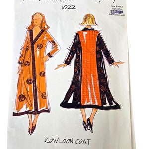 May include: A sewing pattern for a Kowloon coat. The pattern is illustrated with two figures wearing the coat in orange and black. The pattern number is 1022. The text "Paw Prints Patterns Not Returnable" is printed in the top right corner.