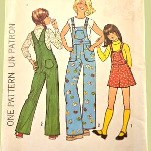 May include: Vintage Simplicity sewing pattern 7032 for children's overalls and jumper. The pattern cover features illustrations of the finished garments in green, blue, and red. The text on the pattern reads "Simplicity" and "Size 6 Child".