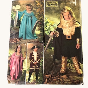 May include: Simplicity costume pattern for children, featuring four different costume designs. The package includes a princess, pirate, and medieval knight costumes. The package has the text "Costumes for kids".