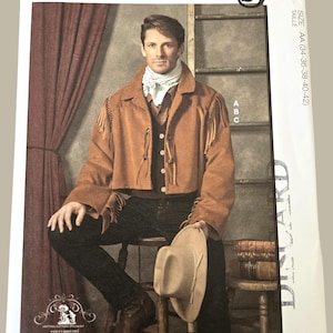 May include: McCall's Costumes pattern showing a man in a brown suede-like jacket with fringe, a white scarf, and a cowboy hat. The pattern includes sizes AA (86-91-97-102-107 cm). Designed and printed in the USA.