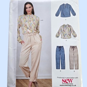 May include: A sewing pattern package from New Look features a woman wearing a floral blouse and beige pants. The package includes illustrations of a blue denim-look blouse, a floral blouse, and two pairs of pants. The text "NEW LOOK" and "K6704" are visible.