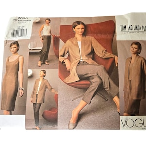 May include: Vogue Patterns sewing pattern featuring a woman in a dress, trousers, and jacket. The pattern includes a dress, trousers, and jacket. The pattern is labelled "2686" and "Tom and Linda Platt Vogue American Designer."