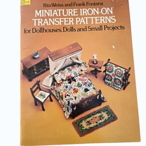 May include: A vintage book titled "MINIATURE IRON-ON TRANSFER PATTERNS" by Rita Weiss and Frank Fontana. The cover features a miniature bedroom set with a bed, dresser, chair, and rug, all with floral patterns. The book is on a yellow background.