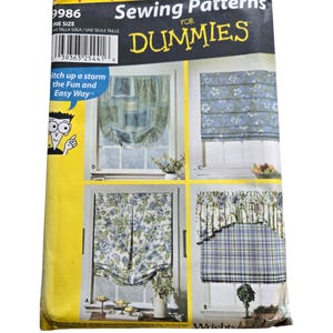 May include: A Simplicity Shades sewing pattern for window shades. The package features four different shade designs, with the text "Sewing Patterns for Dummies" and "itch up a storm the Fun and Easy Way". The package is yellow and white.