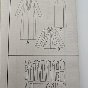 May include: A Vogue Patterns sewing pattern, V1527, featuring illustrations of a long coat, a blouse with a necktie, and a skirt. The pattern also includes diagrams of the pattern pieces. The text "ENGLISH/FRAN&Ccedil;AIS" is visible.