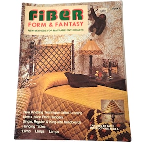 May include: A magazine cover for "Fiber Form & Fantasy" featuring a macrame headboard, lamp, and table. The magazine cover is yellow and brown with a monkey illustration. The text on the cover reads "New Methods for Macrame Enthusiasts".