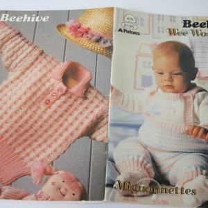 May include: A knitting pattern book titled "Beehive Wee Wonders" featuring a pink and white striped baby sweater and a baby wearing a white and pink striped knitted outfit. The book cover also includes the text "Mignonnettes" and "Beehive Astra".