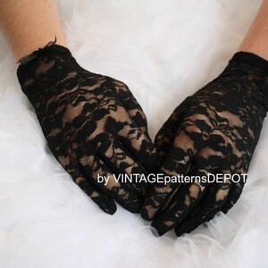 May include: A pair of black lace gloves with a small bow at the wrist.