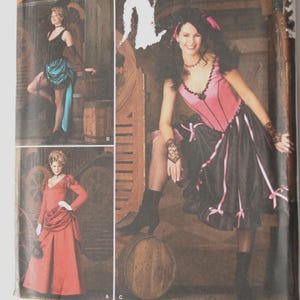 May include: Simplicity sewing pattern featuring three costume designs. The costumes include a pink and black dress, a red dress, and a black top with a teal skirt. The pattern size is HH 6,8,10,12.