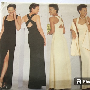 May include: A sewing pattern for three different styles of long evening gowns. The first gown is black with a side slit and a criss-cross back. The second gown is black with a criss-cross back. The third gown is white with a criss-cross back and a matching shawl.