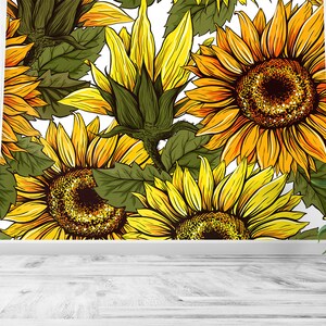 Puede incluir: Un vibrante tapiz floral con grandes girasoles en tonos amarillos y naranjas, con hojas verdes sobre un fondo blanco. El dise&ntilde;o es detallado y art&iacute;stico, con un estilo de ilustraci&oacute;n realista. Una peque&ntilde;a planta de girasol en maceta est&aacute; en primer plano.