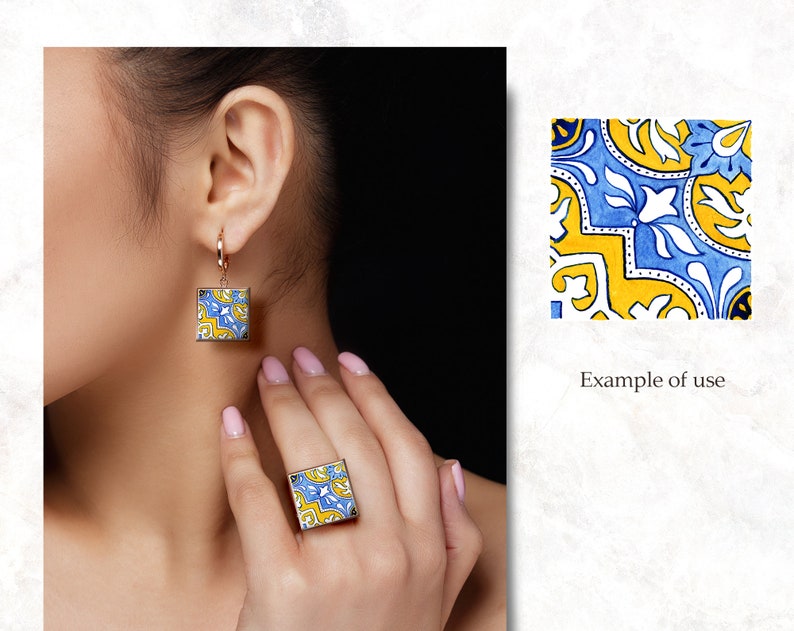 May include: A pair of earrings and a ring featuring a blue and yellow geometric tile pattern. The earrings are square shaped and dangle from a gold hoop. The ring is also square shaped and sits on the finger.