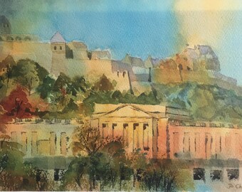 May include: Watercolor painting of a cityscape with a large building in the foreground and a hilltop fortress in the background. The building is painted in shades of pink and yellow, while the fortress is painted in shades of brown and green. The sky is a light blue with a hint of yellow.