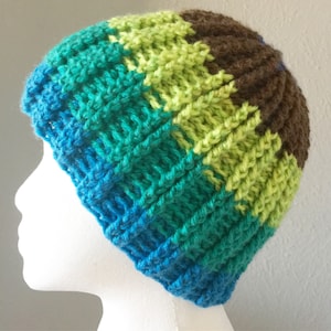 May include: A blue, green, and brown striped knitted beanie hat.