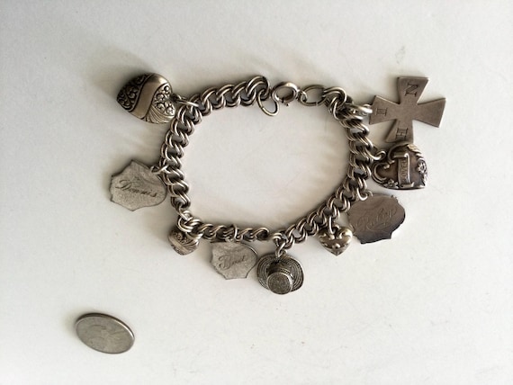 Vintage Sterling Silver Charm Bracelet Marked 9 Charms Marked Sterling.