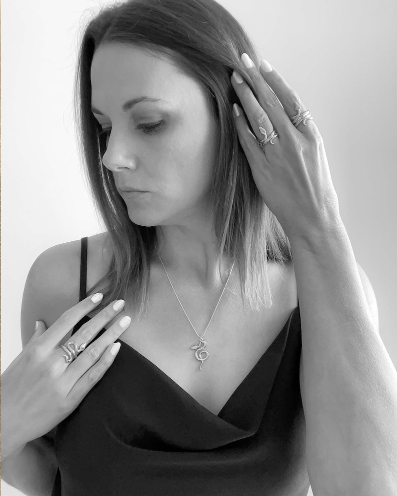 Žaltys Snake Necklace and single, double, and triple wrapped Žaltys Snake Rings on designer Jorie Breonn.