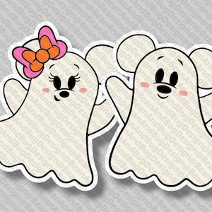 May include: Two die-cut stickers featuring cartoon ghosts with mouse ears. One ghost has a pink bow, the other has a black bow tie. Both have black eyes, noses, and rosy cheeks. The stickers are white with black outlines.