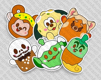 May include: Six Halloween-themed character stickers. The characters are a brown bear with a yellow hat, a yellow dog with a green hat, a red panda with a white hat, a white ghost with a brown hat, a green alien with a white hat, and a green pumpkin with a brown hat.