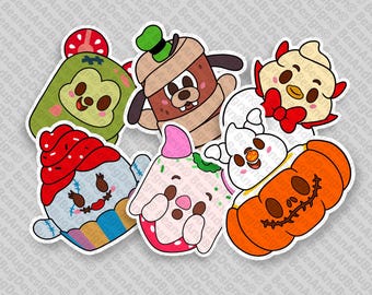 May include: A set of nine Halloween-themed character stickers. The stickers feature a variety of characters, including a zombie cupcake, a ghost, a pumpkin, a witch, a vampire, a Frankenstein, a mummy, a werewolf, and a ghost.