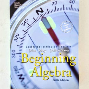 May include: A textbook titled "Beginning Algebra" with a compass design on the cover. The cover includes the text "Annotated Instructor's Edition" and the names John Tobey and Jeffrey Slater. The book is the sixth edition.