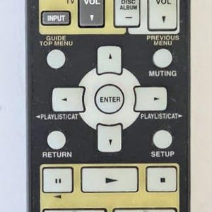 May include: Black Onkyo RC-651M remote control with numerous buttons for various functions. Features buttons for input selection, volume control, and playback options. Includes text labels like "DVD", "TV", and "ONKYO".