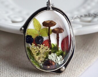 Forest pendant with real mushrooms, blueberry leaves and berries, lichens, moss a tiny snail shell. Real dried mushroom necklace.