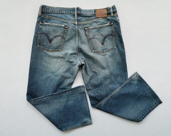 أبيض متأمل غزل 35 waist levi jeans 