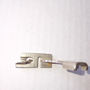 Vintage Singer Slant Shank 5/32 Hemmer Foot Simanco #161195  Singer Sewing machine etc as removed and shown vintage Simanco part