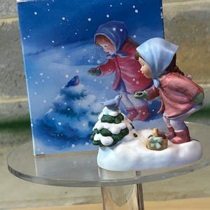 1986 Avon Music Box “We Wish You A Merry Christmas&quot; Figurine Girl Feeding Birds