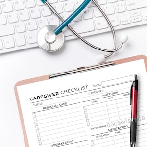 May include: A caregiver checklist with sections for personal care, housekeeping, nutrition, and medications. The checklist is printed on white paper and has a black and white design. A red pen is lying on the checklist.