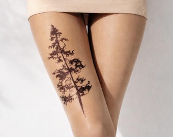 Sheer tights with black pine tree motifs