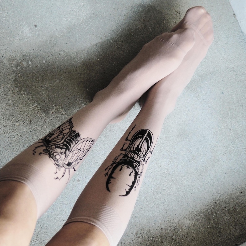Hand-painted tattoo socks featuring intricate cicada and beetle artwork, perfect for entomology lovers, bug enthusiasts, and goblincore fashion. These unique, nature-inspired socks create a realistic tattoo illusion, combining art and style in wearable form. A thoughtful and quirky insect-themed gift for those who appreciate novelty and handcrafted designs.