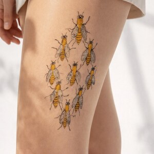 tattoo effect pantyhose featuring multiple bees on upper leg, unique botanical and wildlife aesthetic