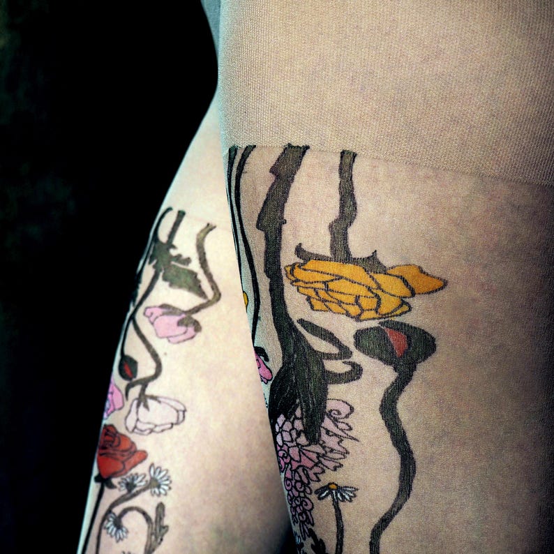 close up of colorful wildflower design on sheer tattoo tights