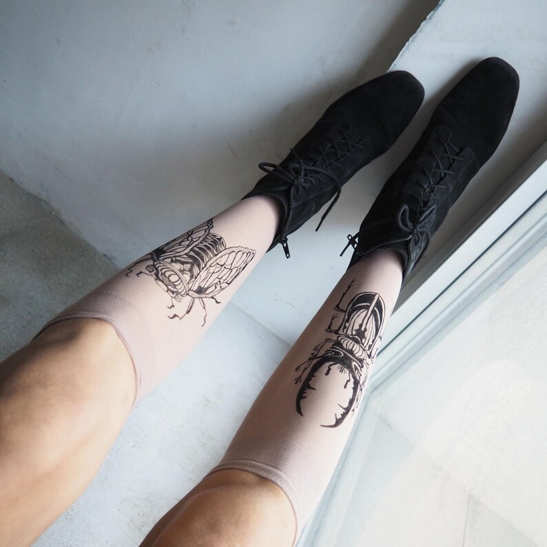 Hand-painted tattoo socks featuring intricate cicada and beetle artwork, perfect for entomology lovers, bug enthusiasts, and goblincore fashion. These unique, nature-inspired socks create a realistic tattoo illusion, combining art and style in wearable form. A thoughtful and quirky insect-themed gift for those who appreciate novelty and handcrafted designs.