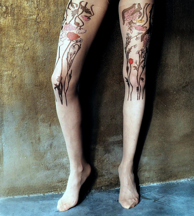 Printed tights with colorful wildflower design on legs features flowers and leaves with pink, red, and yellow accents.