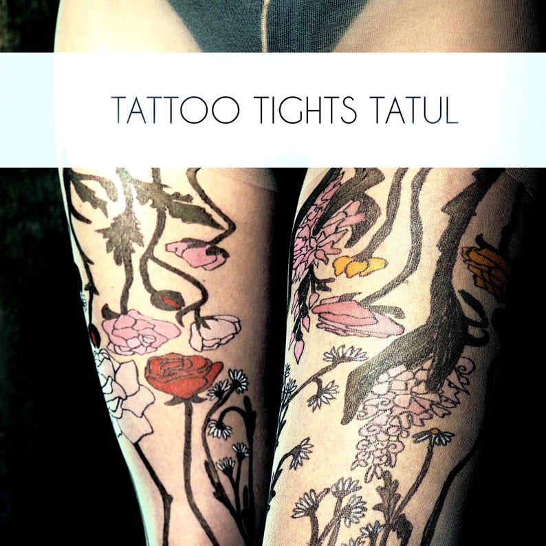 May include: Black and white floral tattoo tights with pink, red, and yellow flowers. The tights have the text "TATTOO TIGHTS TATUL" printed on them.