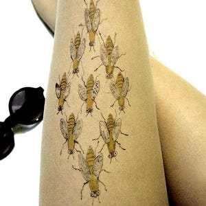 sheer tights with detailed bee pattern, nature inspired legwear for everyday outfits and unique styling