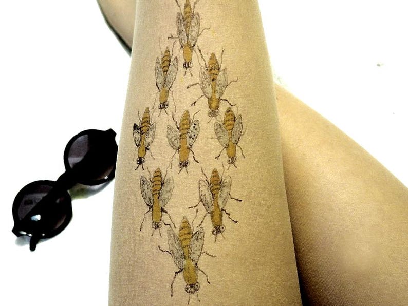 sheer tights with detailed bee pattern, nature inspired legwear for everyday outfits and unique styling