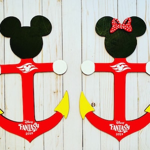 May include: Two red wooden anchors with Mickey Mouse and Minnie Mouse heads. The anchors have white and yellow accents and the text "Disney Fantasy 2019" on the bottom.