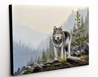 May include: A gray wolf stands on a rocky cliff overlooking a misty forest. The wolf has a black stripe down its back and a white chest. The forest is in the background, with a few trees in the foreground. The wolf is looking directly at the viewer.