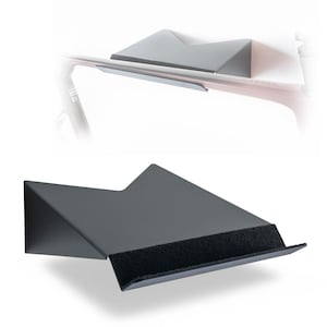 May include: A black metal bicycle wall mount. The mount features a geometric design with a flat base and a padded surface for the bike frame. It is designed to hold a bicycle, keeping it off the floor.