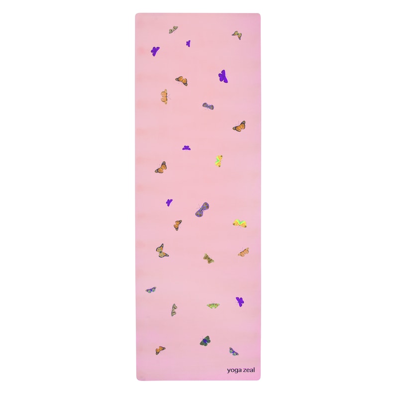 May include: A pink yoga mat with a scattered pattern of colorful butterflies. The text "yoga zeal" is printed in the bottom right corner.