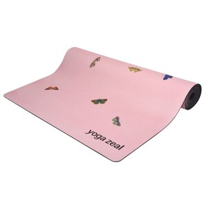 May include: A pink yoga mat with a butterfly design and the text "yoga zeal" printed on the bottom right corner.