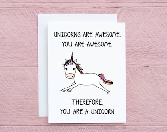May include: A white card with a black and white illustration of a unicorn with a rainbow horn. The card reads "Unicorns are awesome. You are awesome. Therefore, you are a unicorn."