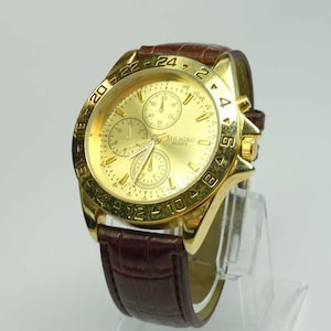 Mens Milagro Gold Tone Quartz Multi Function Dress Watch champagne stick dial