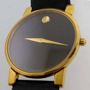 Vintage 31mm Men&#39;s Movado Museum Dial Watch Gold over Black Almost Never Worn, Movado Band w gold tone Buckle 87 G4 875 original Box Papers