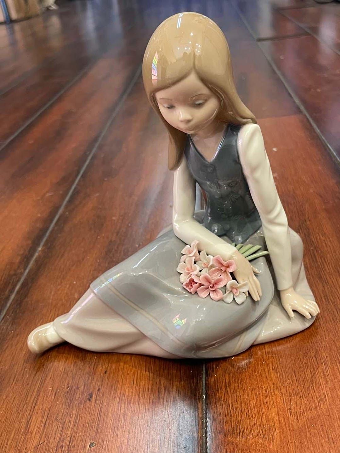 Young seated Girl With Bouquet of Flowers Lladro Figurine